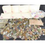 A large collection of circulated, mainly UK, coins, bank note and various loose stamps.