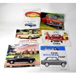 A selection of 1960s British car brochures, including Mini, Rover, Hilman and Sunbeam.