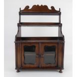 An antique mahogany miniature open back dresser, the top with two shelves resting on a cabinet base,