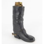 A novelty table lighter in the form of a leather-clad boot with brass spur, height 16.5cm.