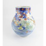 A late 19th/early 20th century Japanese baluster vase decorated with pea hen, garden flowers,