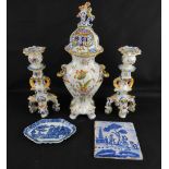 A pair of late 19th/early 20th century Continental polychrome tin glazed candlesticks, height 25cm,