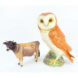 BESWICK; two porcelain figures, a Jersey cow and a Tawny owl (2).
