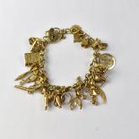 A 9ct gold charm bracelet with approximately twenty charms, to include Bible, greyhound, doll, dart,