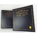 Two 'The Royal Family' stamp folders, one with stamps for the royal anniversary 1991,