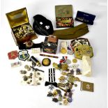 Various items of militaria to include cap badges, buttons, caps, belt buckles, embroidered badges,