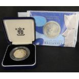A 2003 Britannia silver £2 coin in blister pack, together with a 1992-93 silver proof 50p coin,