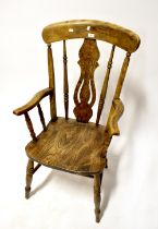 A 19th century elm stick back open armchair with vase-shaped splat,