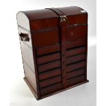 A leather covered jewellery, watch and accessory box with domed lift-up lid and fitted interior,