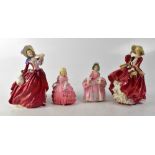 ROYAL DOULTON; four figures comprising HN1934 'Autumn Breezes', HN1834 'Top o' the Hill',