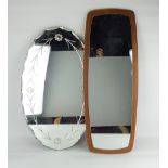 An oval reverse cut scalloped-edge wall mirror with floral decoration, 68 x 42cm,