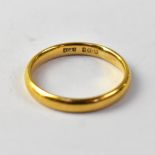 A 22ct gold wedding band, size P, approx 4.1g.