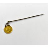 An 1862 US $1 coin attached to a scarf pin, length of pin approx 7cm.