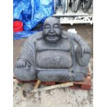A large carved Paleo garden statue of a seated Buddha, approx 750kg, approx 65 x 110 x 77cm.