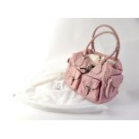 CHRISTIAN DIOR; a 'Diorissimo' pink canvas and pink calfskin leather satchel-style tote bag,