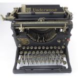 THE UNDERWOOD; a vintage black and metal bodied typewriter.