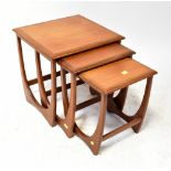 G PLAN; a nest of three teak tables.