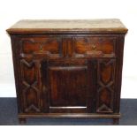 A 17th century oak cabinet with moulded