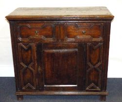 A 17th century oak cabinet with moulded