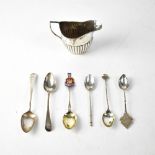 A hallmarked silver helmet cream jug and five various hallmarked silver tea and coffee spoons,