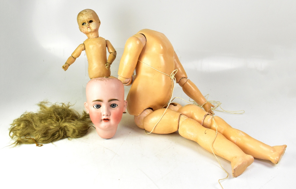 A very large early 20th century German bisque headed doll with open mouth and rolling eyes,