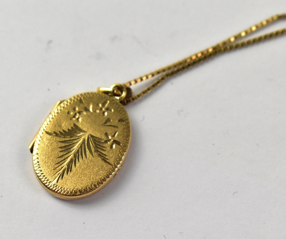A 9ct gold oval double locket on a 9ct dainty chain, length 55cm, approx 7.7g. - Image 2 of 3