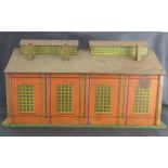 HORNBY MECCANO; a lithograph printed tin plate model railway engine shed, length 50cm.