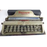CHARLES BENNETT; an early 20th century portable typewriter in travel case.