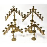 A pair of 19th century brass ecclesiastical candle holders with adjustable branches holding nine