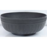 WEDGWOOD; a 19th century black basalt bowl with engine turned border and fluted design body, 10.