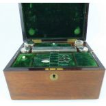 A Victorian rosewood vanity box with brass shield to the top,