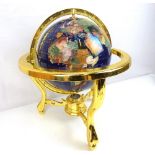 A decorative modern polished agate globe in brass table frame, diameter of globe approx 21cm.