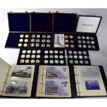 A collection of commemorative coins, mainly relating to aviation,