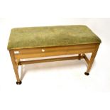 A 1940s walnut upholstered duet stool wi