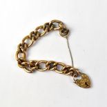 A Victorian 9ct rose gold hollow link bracelet with heart-shaped 9ct gold padlock clasp and safety