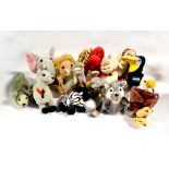 A small collection of Coca-Cola branded Beanie Baby style plush toys from the International