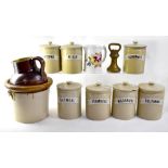 Seven vintage stoneware storage jars with stone raised name plates for 'Macaroni',
