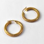 A pair of 9ct gold hollow twist hoop earrings, width approx 3cm, approx 2.1g.