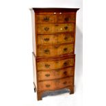 A Georgian-style walnut serpentine fronted chest-on-chest,