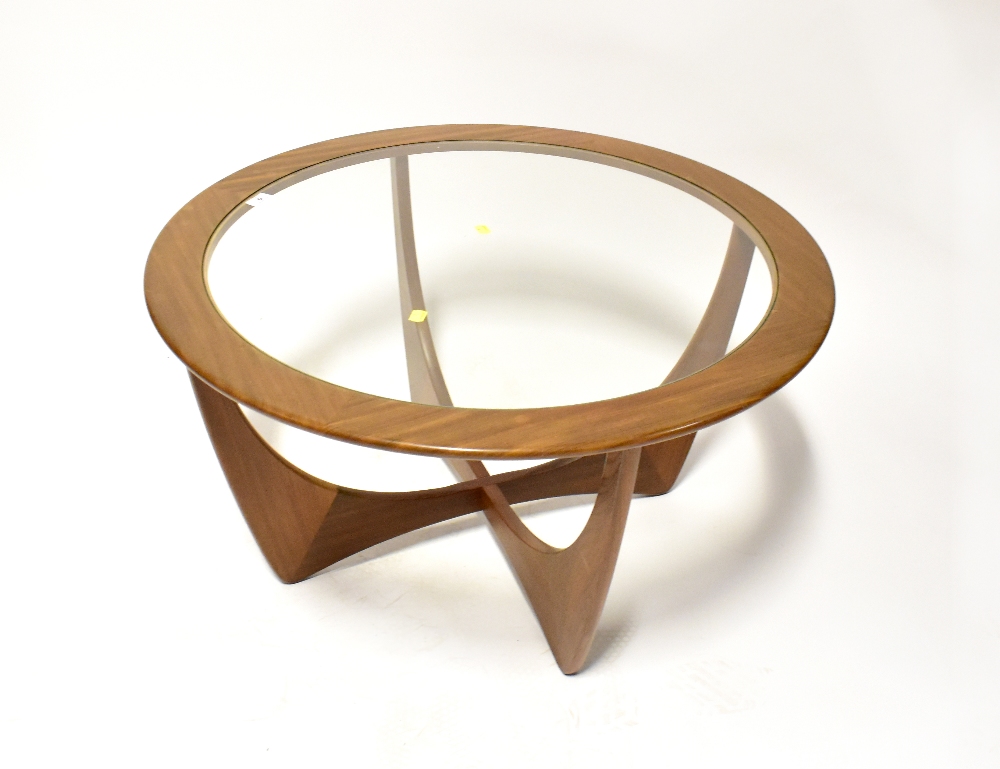 G PLAN; an Astro glass topped circular coffee table, diameter 83cm.