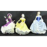 ROYAL DOULTON; three porcelain figures, HN4558 'Christmas Day 2004',