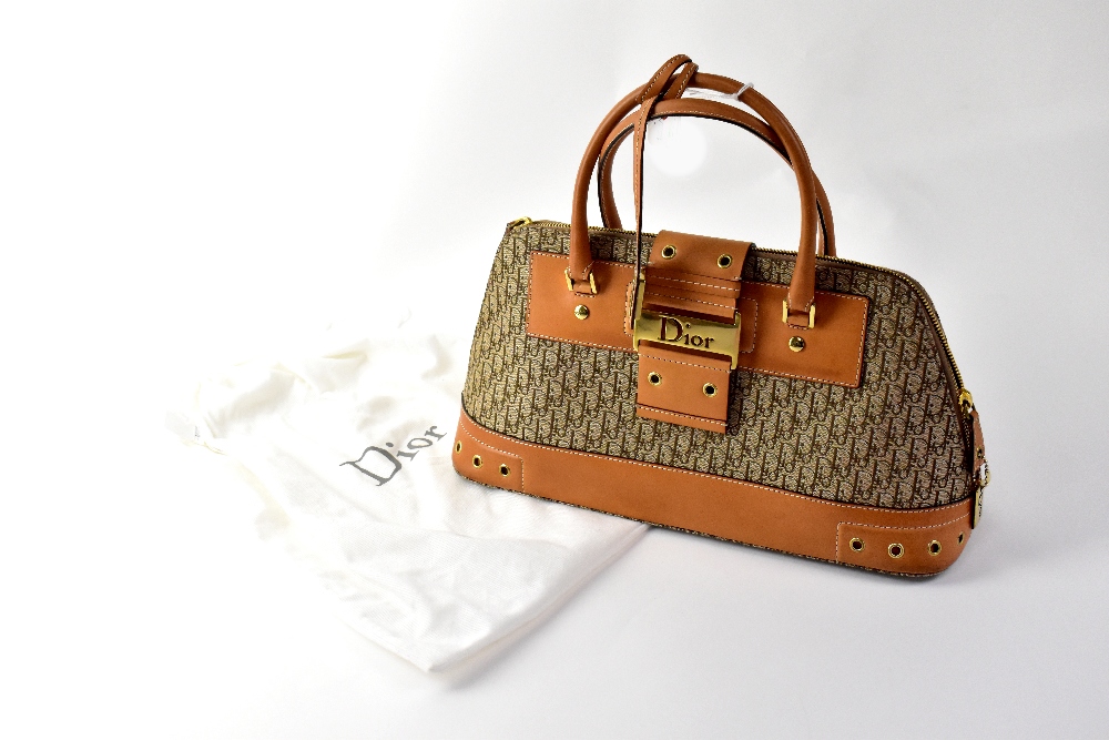 CHRISTIAN DIOR; a 'Diorissimo' brown canvas bag with leather trim,