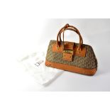 CHRISTIAN DIOR; a 'Diorissimo' brown canvas bag with leather trim,