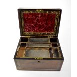 A Victorian rosewood vanity case with fitted interior and lift-out tray with fitted velvet slope to