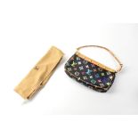 LOUIS VUITTON; a multicoloured monogram bag with tan leather trim and brass stud hardware,