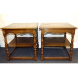 A pair of reproduction oak square-topped bedside tables with under shelf,