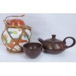 Oriental items to include a small Yixing-style teapot and tea bowl with carved text and script to