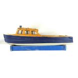 A kit built motorised scale model Police boat with blue and white hull, in a fitted case,