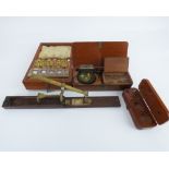 A virtually complete set of brass postal scales, in mahogany box with tweezers,