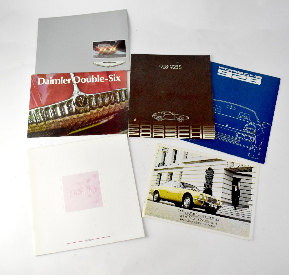 A selection of 1970s and 1980s car brochures, to include Porsche, Aston Martin and Daimler.